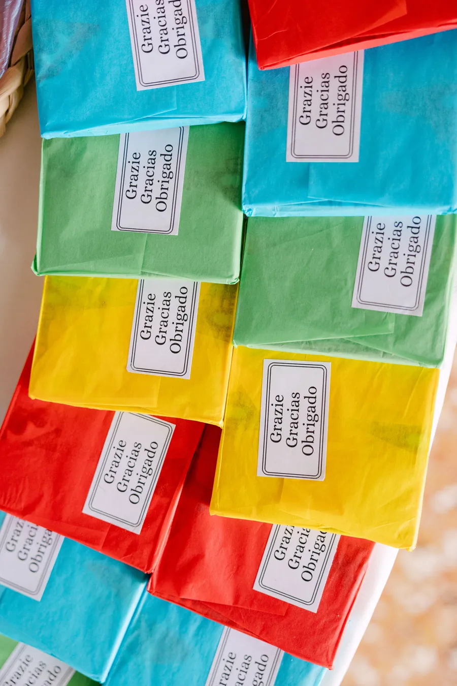 Colourful multilingual wedding favour boxes