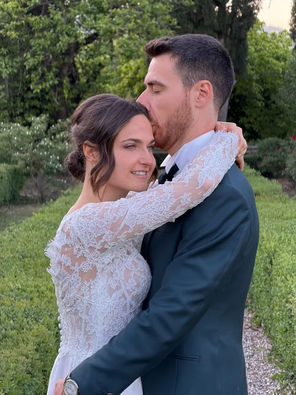 Wedding couple embracing at golden hour