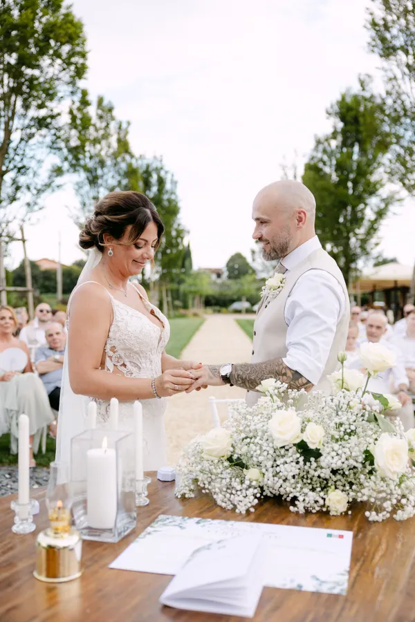 Couple exchanging rings at the ceremony