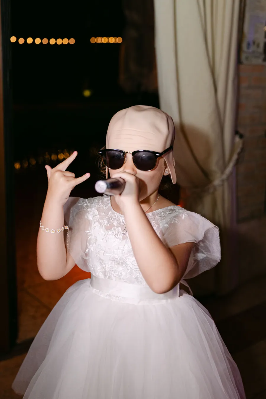 Little flower girl having fun at the reception